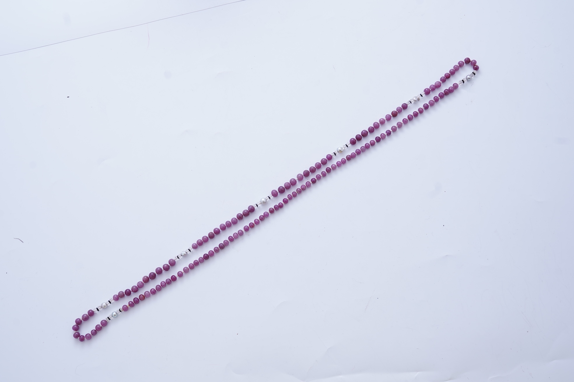 A ruby bead, onyx, rock crystal and pearl necklace